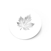 White circular pastry stencil featuring a detailed vine leaf cutout design.