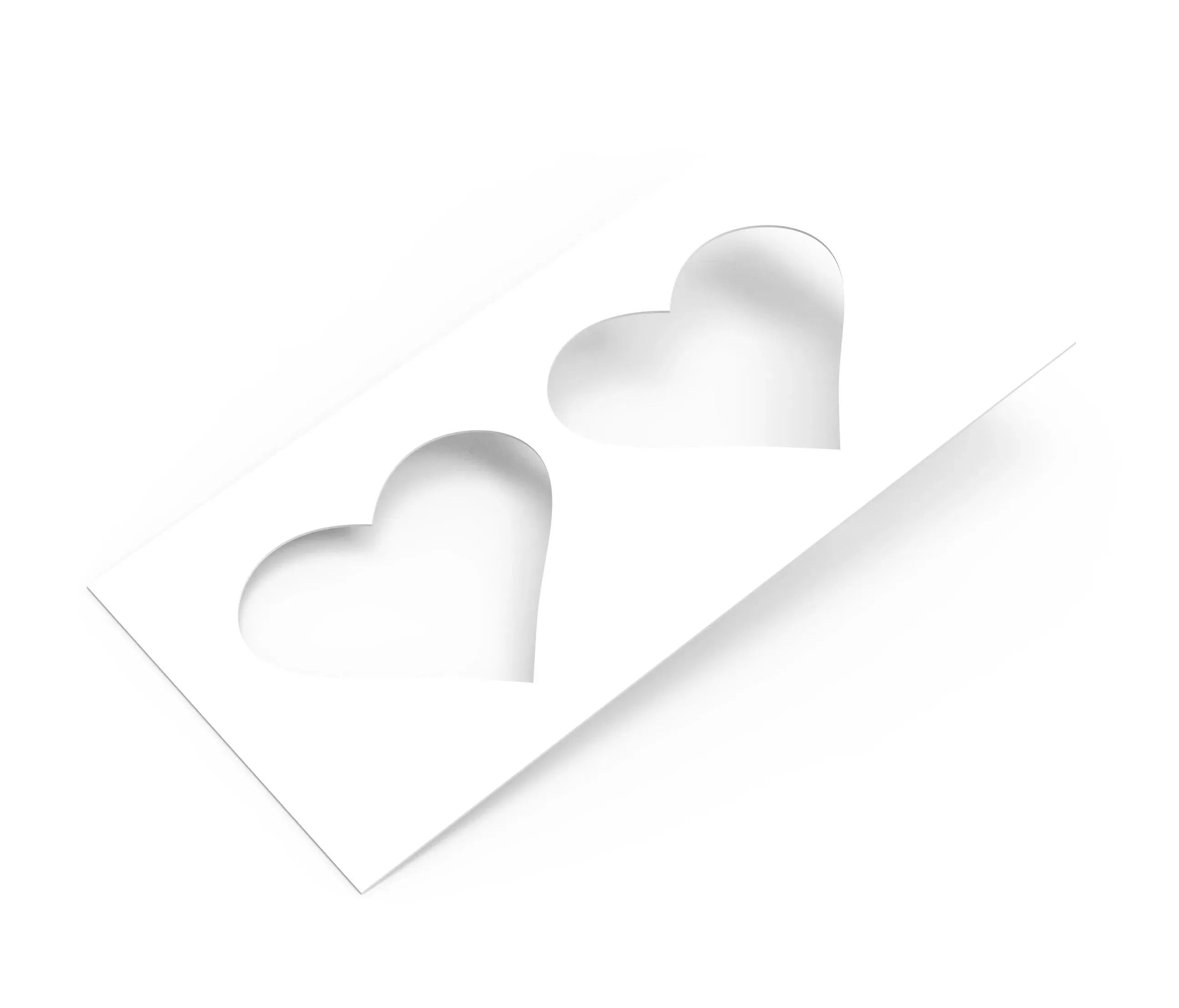 White rectangular pastry stencil featuring two heart-shaped cutouts.