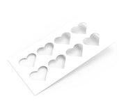 White rectangular pastry stencil featuring eight heart-shaped cutouts in two rows.