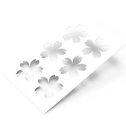 White Sakura pastry stencil with six cherry blossom flower cutouts.