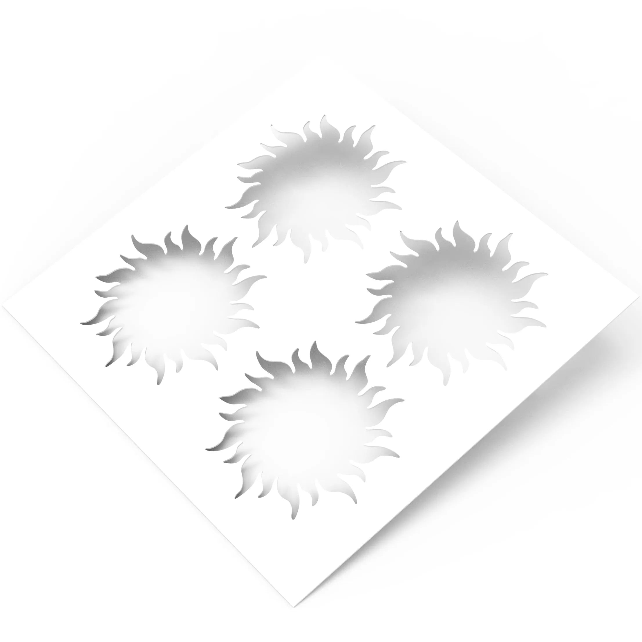 White square pastry stencil featuring four detailed sun-shaped cutouts with wavy rays.