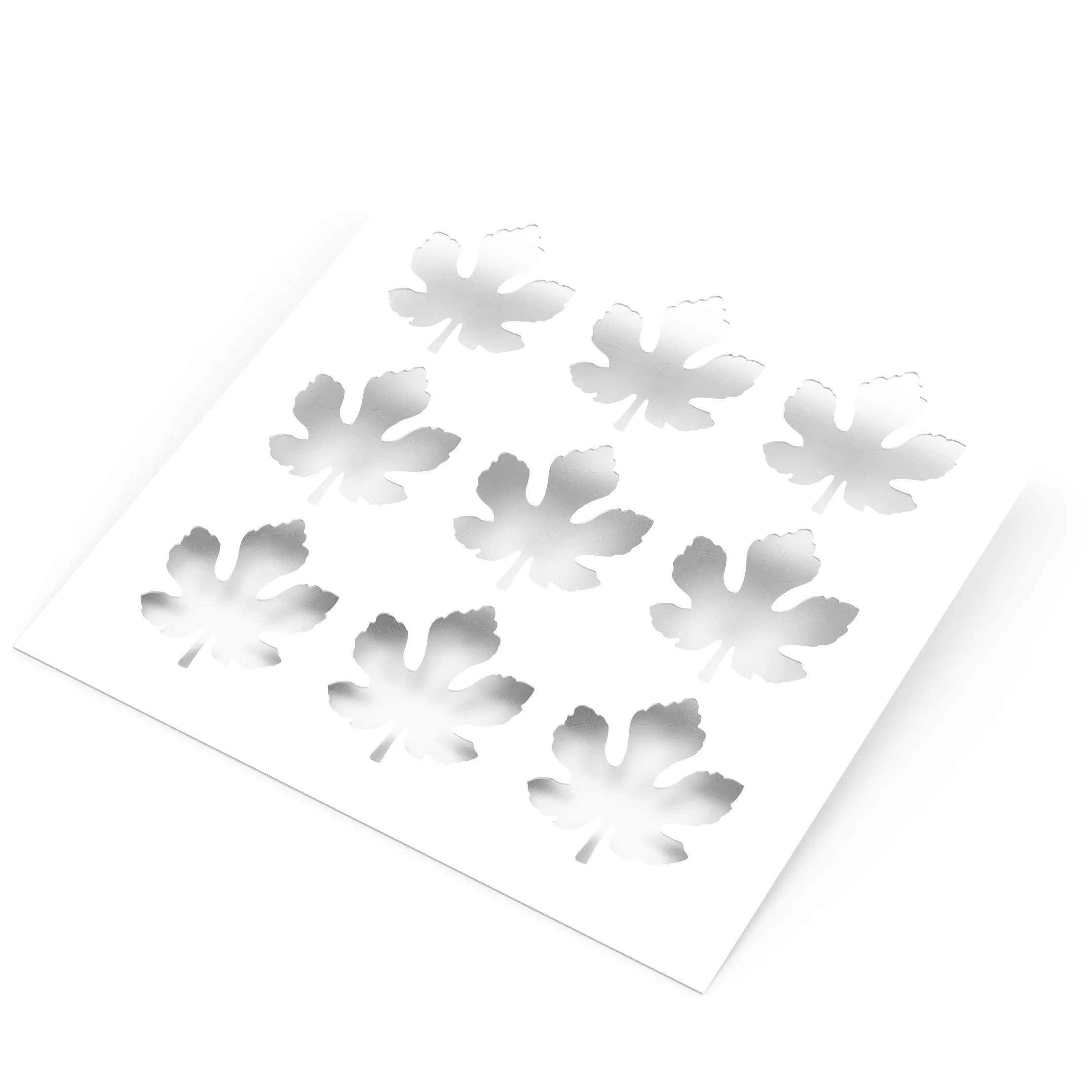 White square pastry stencil featuring nine realistic fig leaf shaped cutouts.