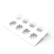 White strawberry calyx pastry stencil with eight leaf-shaped cutouts for dessert decorating.