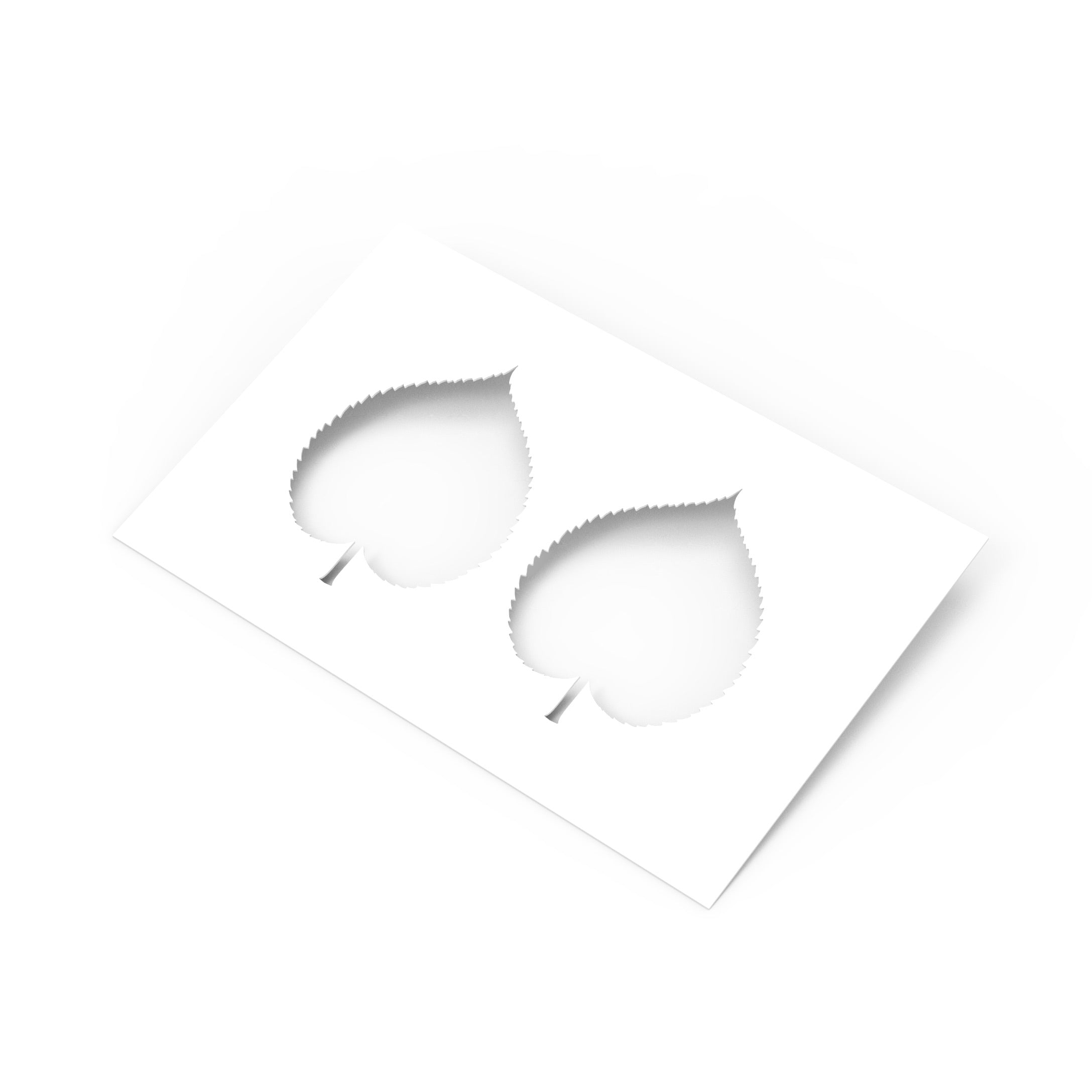 White Linden leaf pastry stencil with two heart-shaped botanical cutouts on a clean background.
