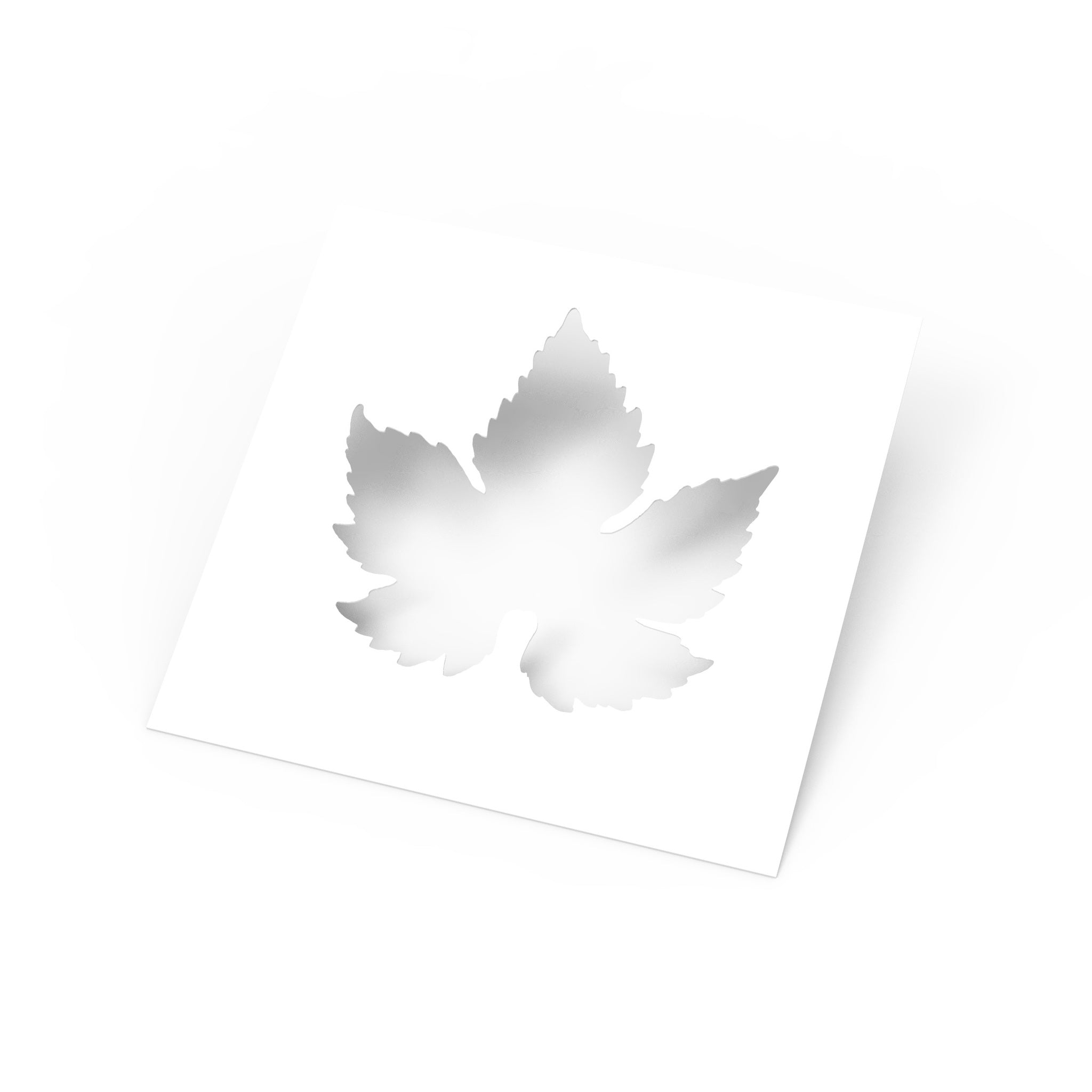 White square culinary stencil featuring a detailed vine leaf cutout shape.