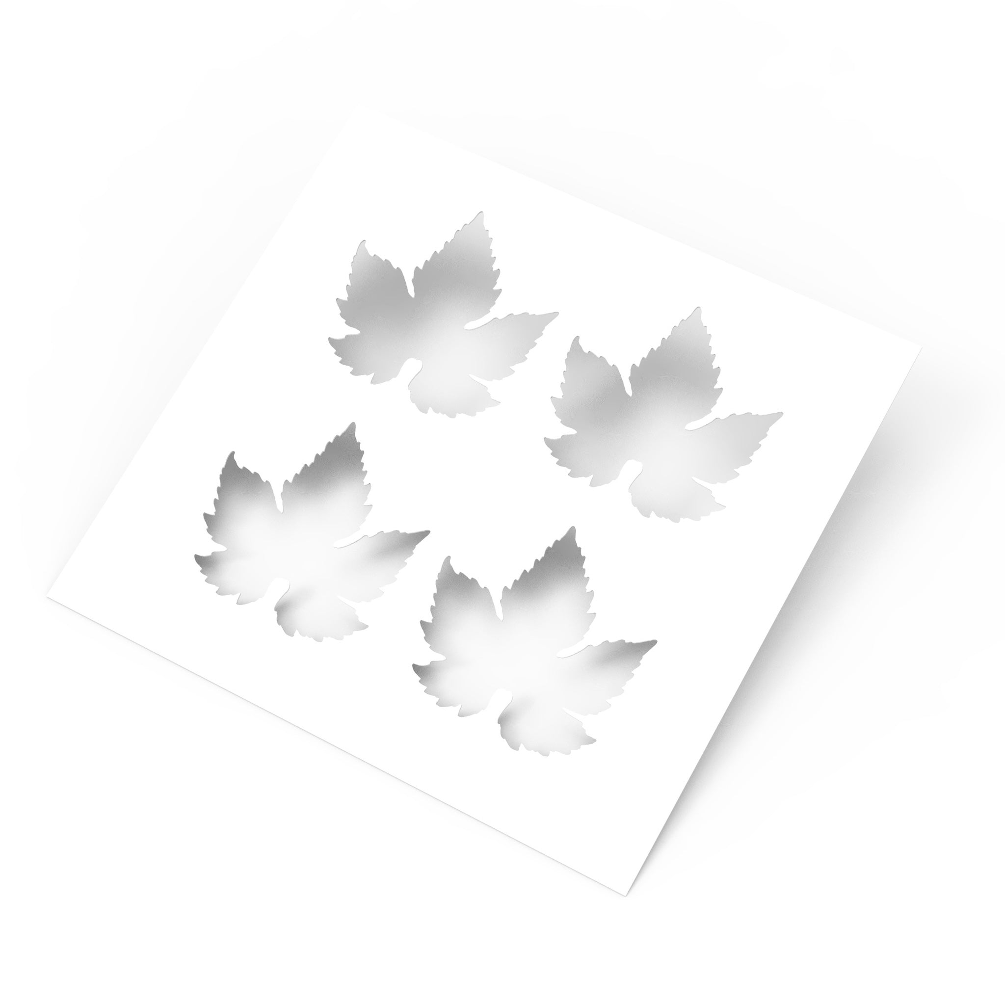White square culinary stencil featuring four detailed vine leaf cutouts.