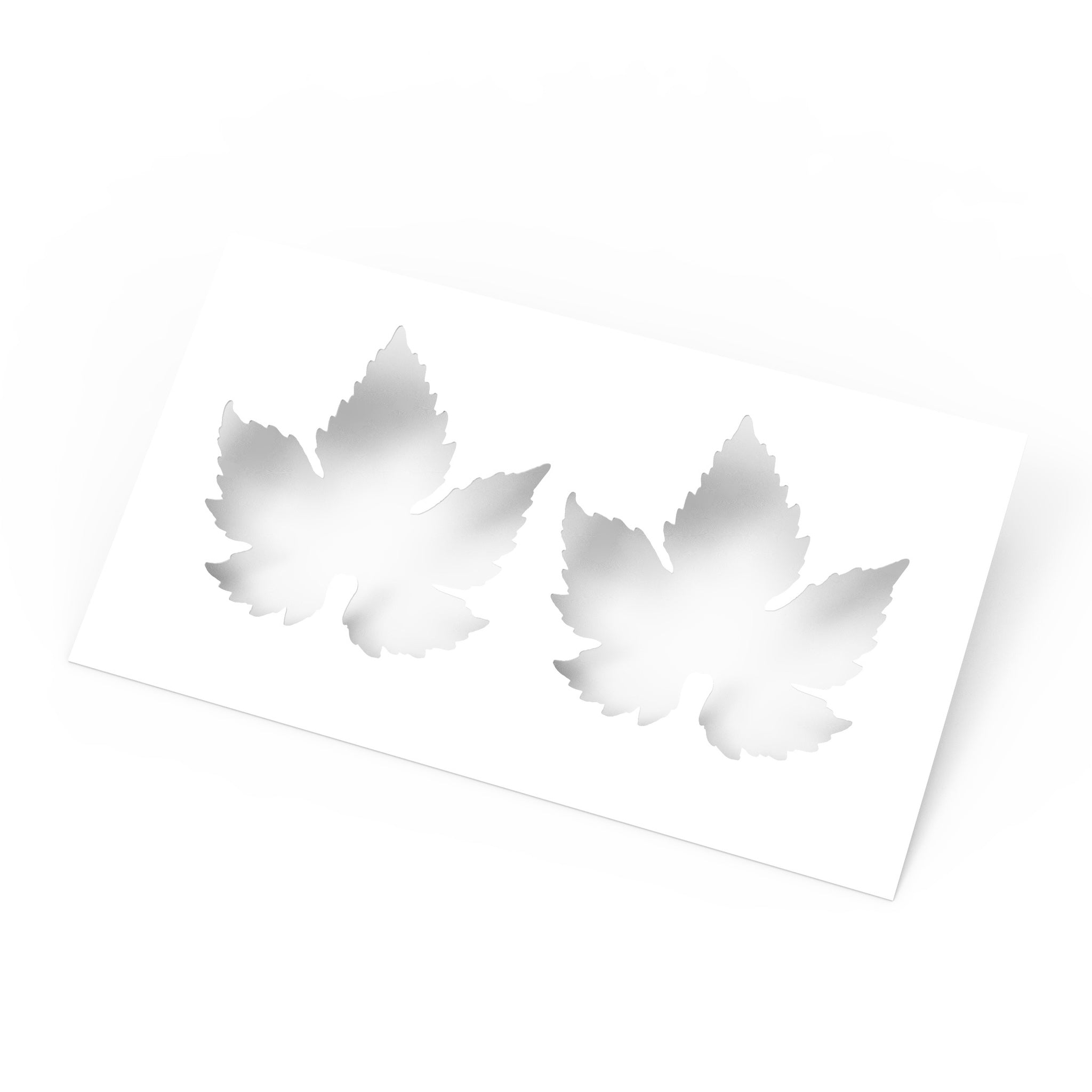 White rectangular culinary stencil featuring two detailed vine leaf cutouts.