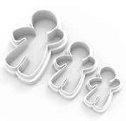 Three white plastic gingerbread man cookie cutters in small, medium, and large sizes.