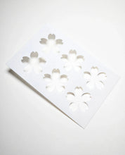 White Sakura pastry stencil with six cherry blossom cutouts.