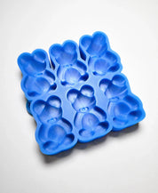 Blue silicone baking mold with six detailed teddy bear-shaped cavities.