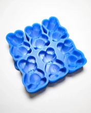 Blue silicone mold with six detailed bear-shaped cavities for baking and chocolate making.