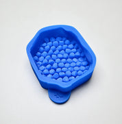 Blue silicone honeycomb fragment mold with irregular, realistic cell shapes.
