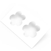 White plastic pastry stencil with two five-petal strawberry flower cutouts.