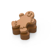 Brown gingerbread boy silicone mold stacked on a matching brown base.
