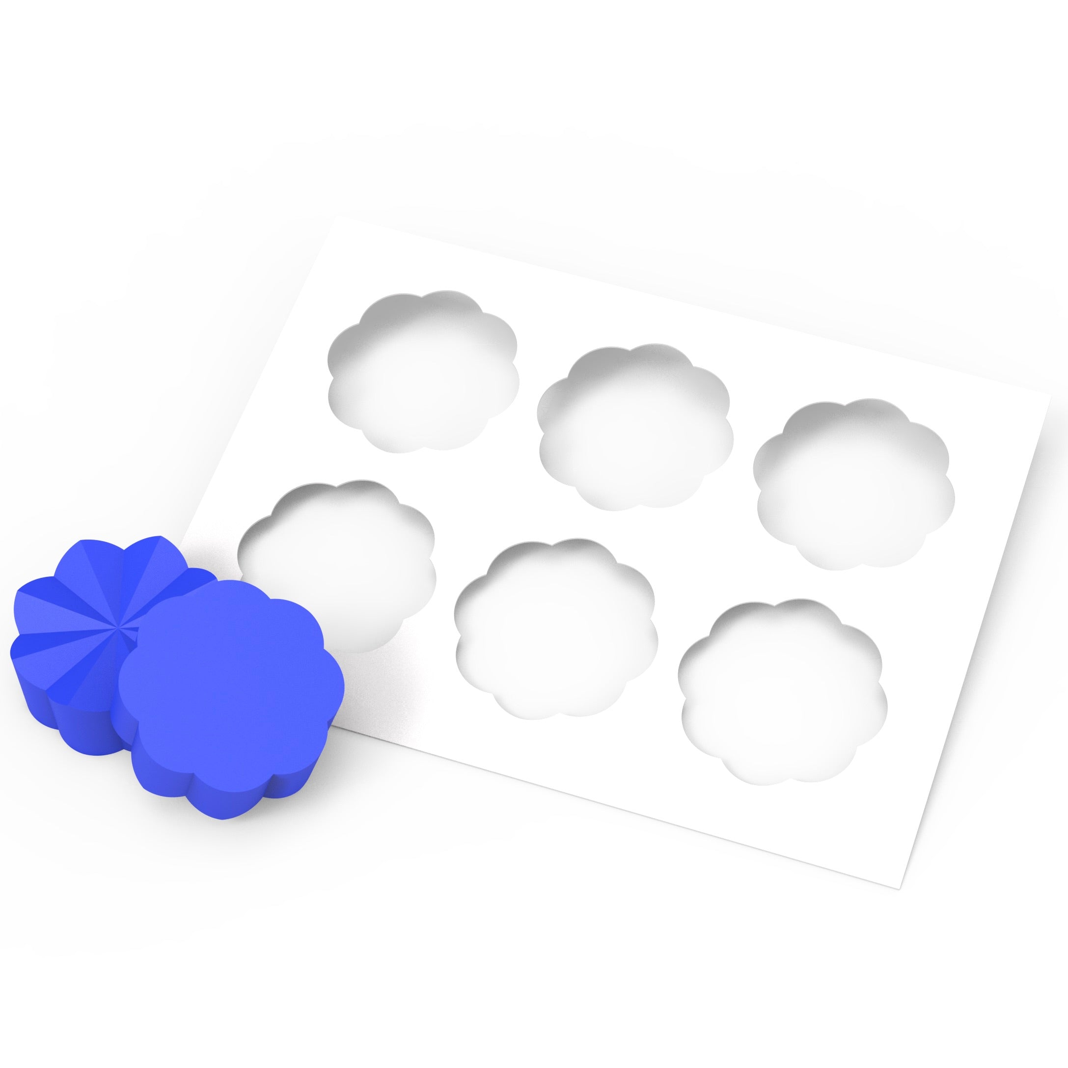 Blue silicone Helios pastry press with flower-shaped molds and a white template.
