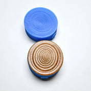 Blue silicone Resonance pastry press showing concentric oval textured molds.