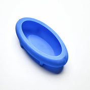 Blue silicone ellipse mold with a smooth, deep oval cavity for pastry design.