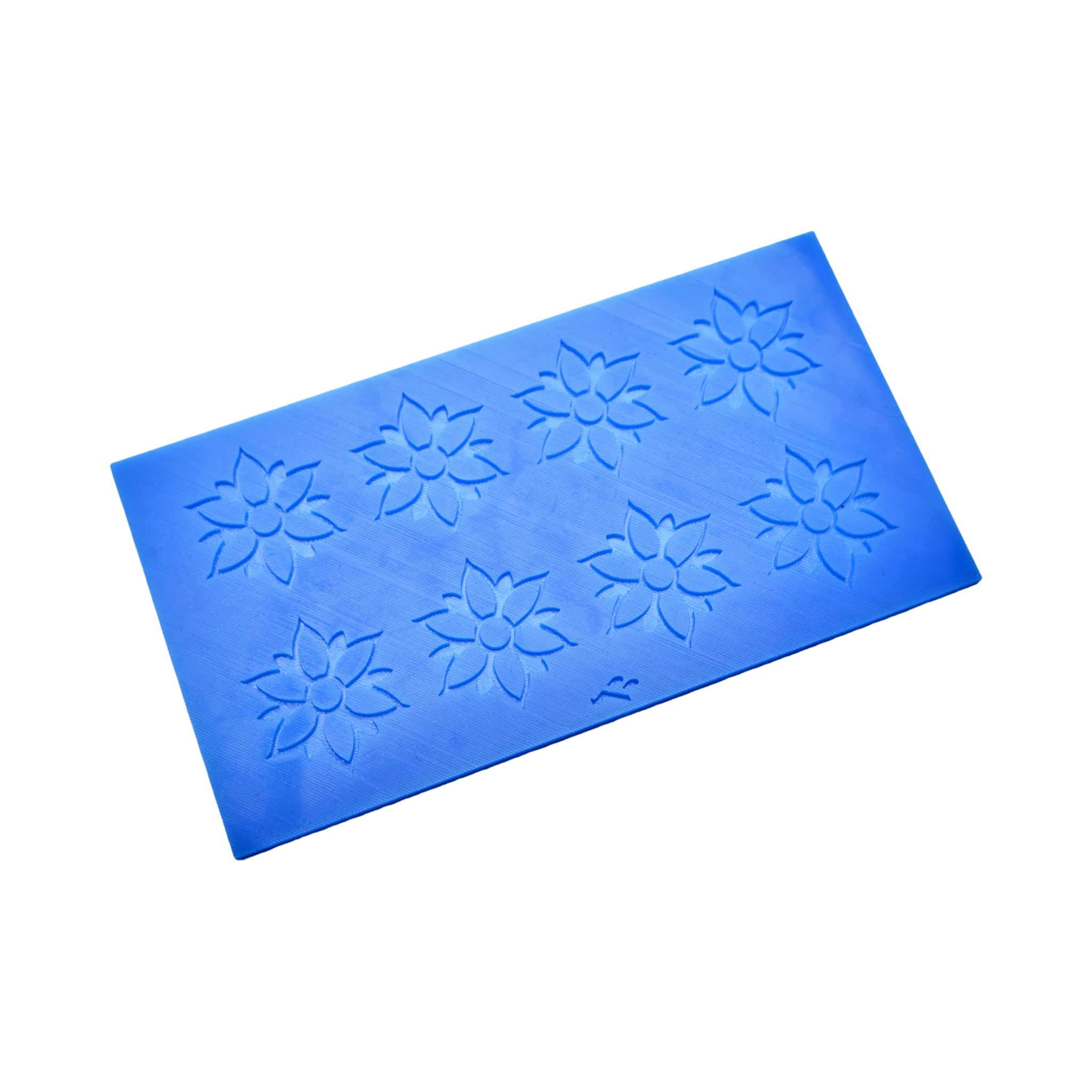 Blue Onalia silicone tuile mat featuring eight detailed flower-shaped molds.