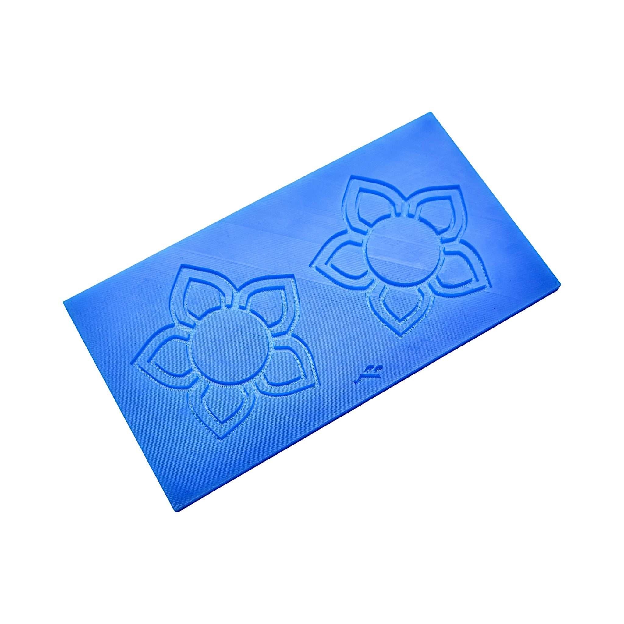 Blue silicone Floris tuile mat with two five-petal flower molds.