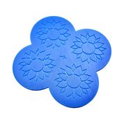 Blue silicone pastry mat with four circular molds featuring detailed sunflower shapes.