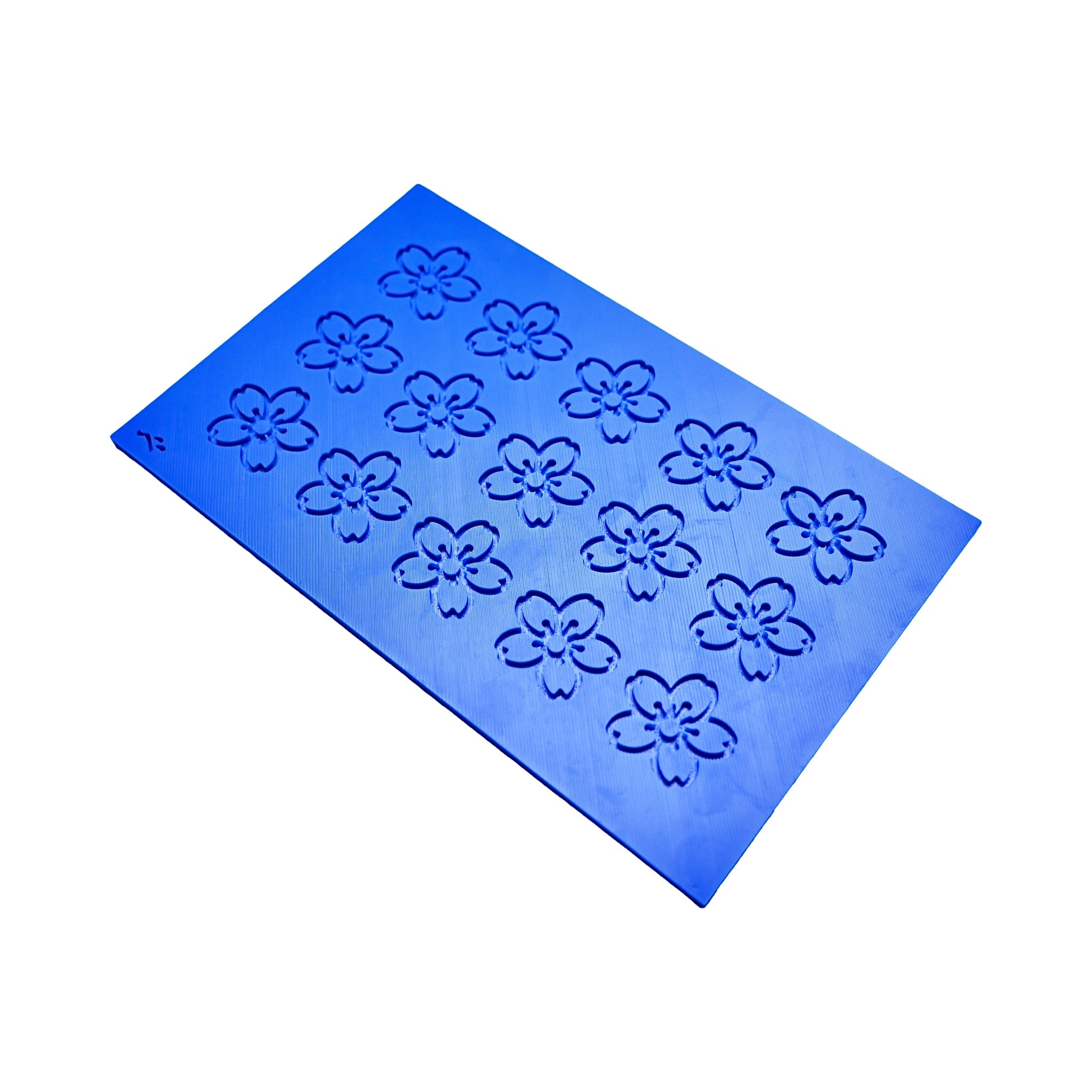 Blue silicone tuile mat with fifteen cherry blossom sakura flower molds.