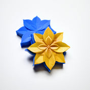 Blue silicone lotus flower mold with a textured golden lotus pastry shape.