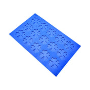 Blue silicone Oxalis tuile mold mat with clover-shaped cavities.