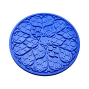 Blue circular Regalia silicone mat with intricate, ornamental floral and leaf-shaped molds.
