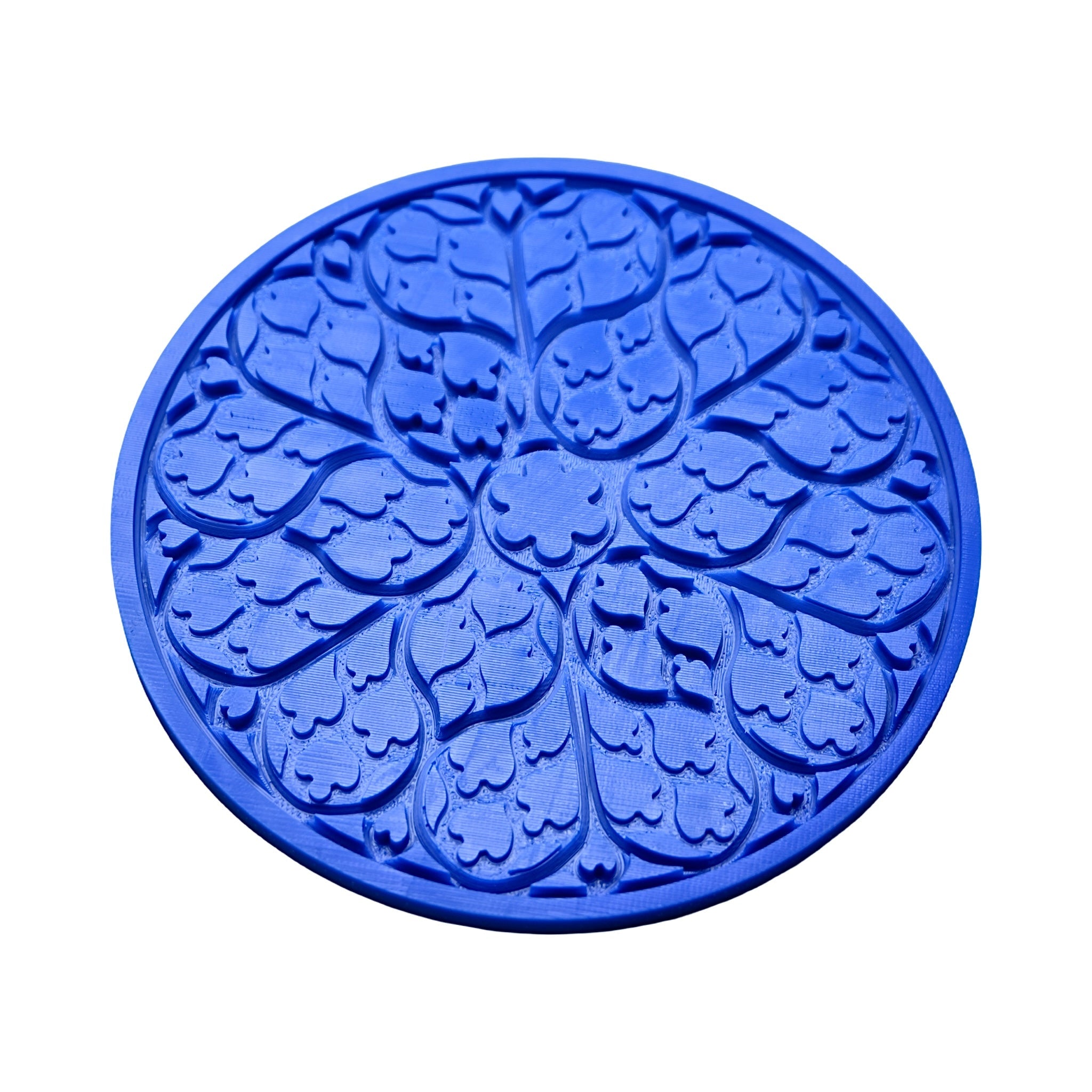 Blue circular Regalia silicone mat with intricate, ornamental floral and leaf-shaped molds.