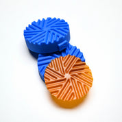 Blue Helix silicone pastry molds with a matching spiral-patterned golden tuile cookie.