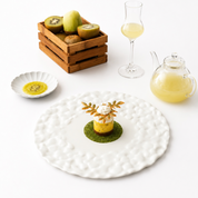 Plated dessert topped with leaf-shaped Tagelia tuiles made from a silicone mold.