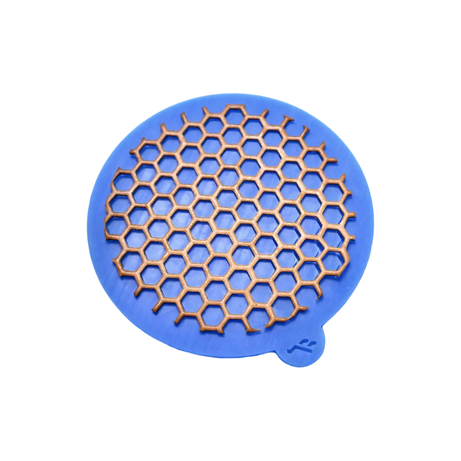 Blue silicone round mat with a hexagonal honeycomb-shaped tuile mold.