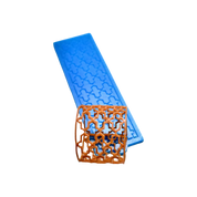 Blue silicone Baroque tuile mat with a curved, brown lace pastry garnish.