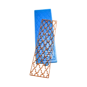 Blue silicone Baroque tuile mold with a matching brown lace pastry crisp.