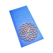 Blue silicone rosette tuile mold with a golden, circular lace-like pastry decoration.