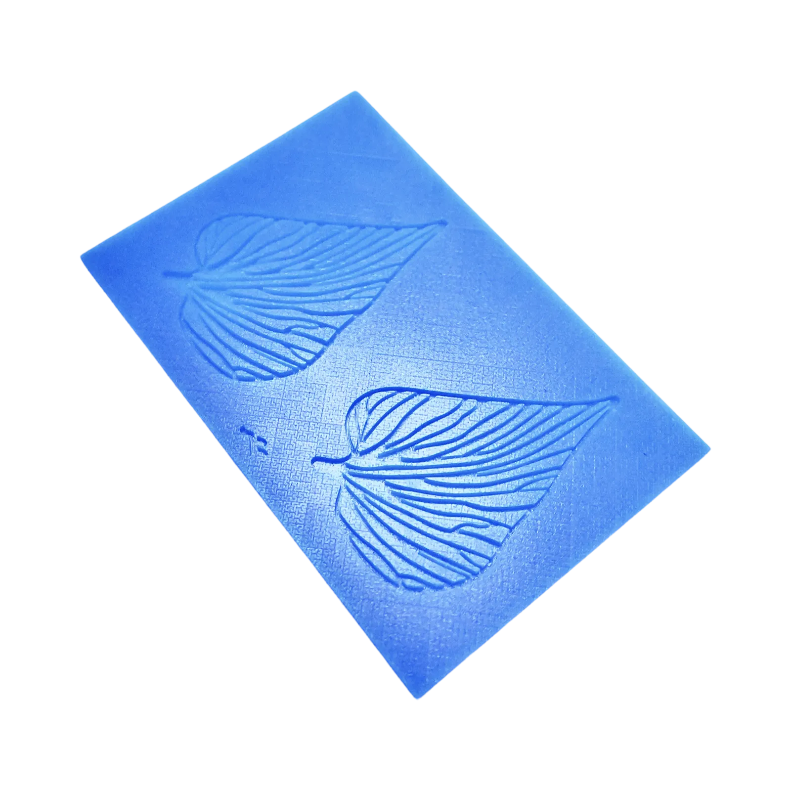 Blue silicone Folia tuile mat featuring two detailed leaf-shaped molds with organic vein patterns.