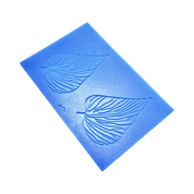 Blue silicone Folia tuile mat featuring two detailed leaf-shaped molds with organic vein patterns.