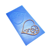 Blue silicone tuile mat with intricate heart-shaped molds and a golden pastry tuile.