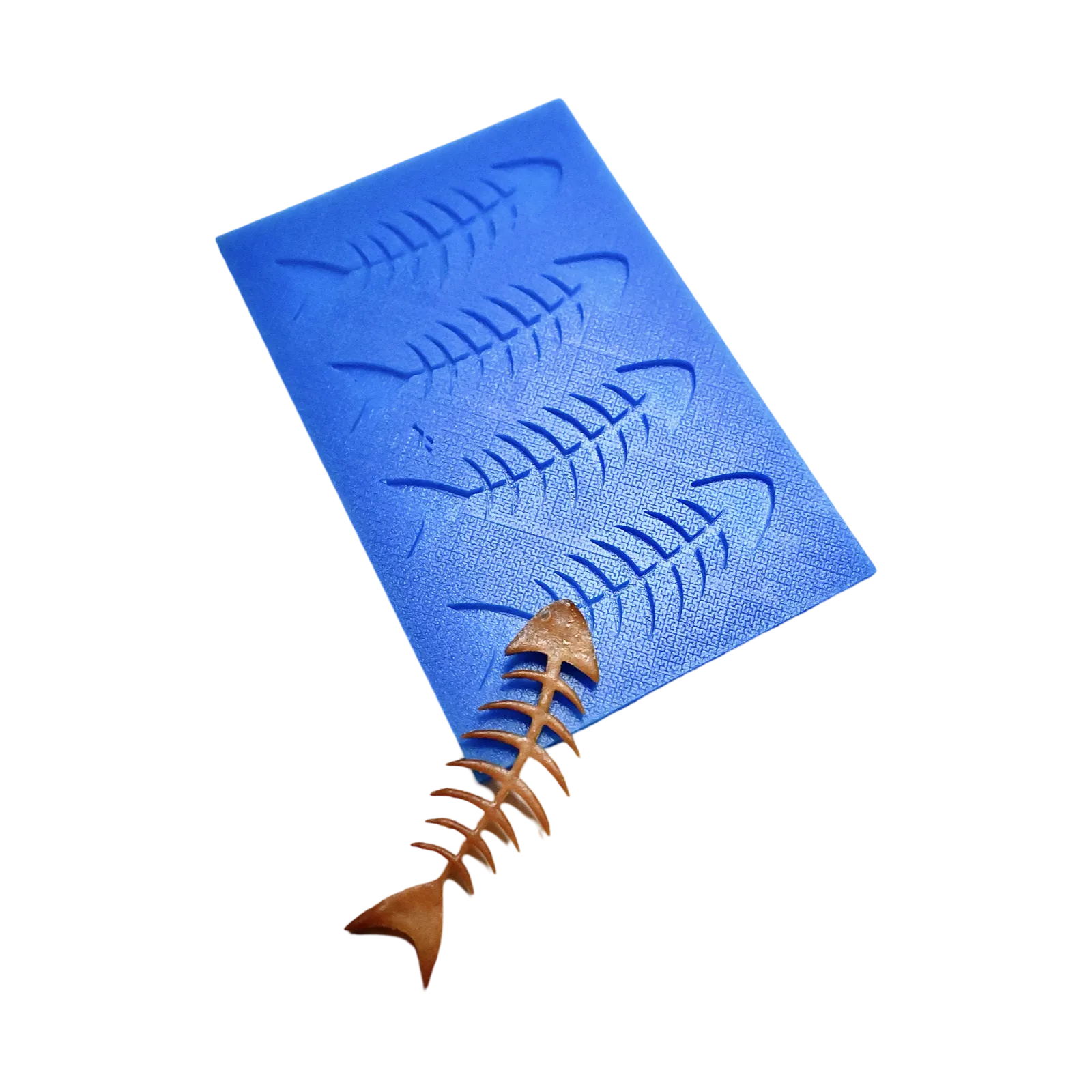 Blue silicone tuile mat with four fish skeleton molds and a matching brown crispy tuile.