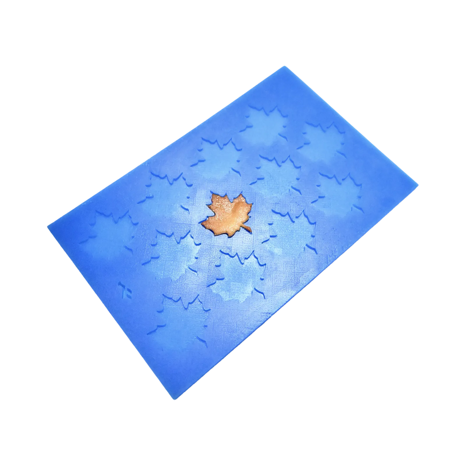 Blue silicone tuile mat with detailed maple leaf shaped mold cavities.