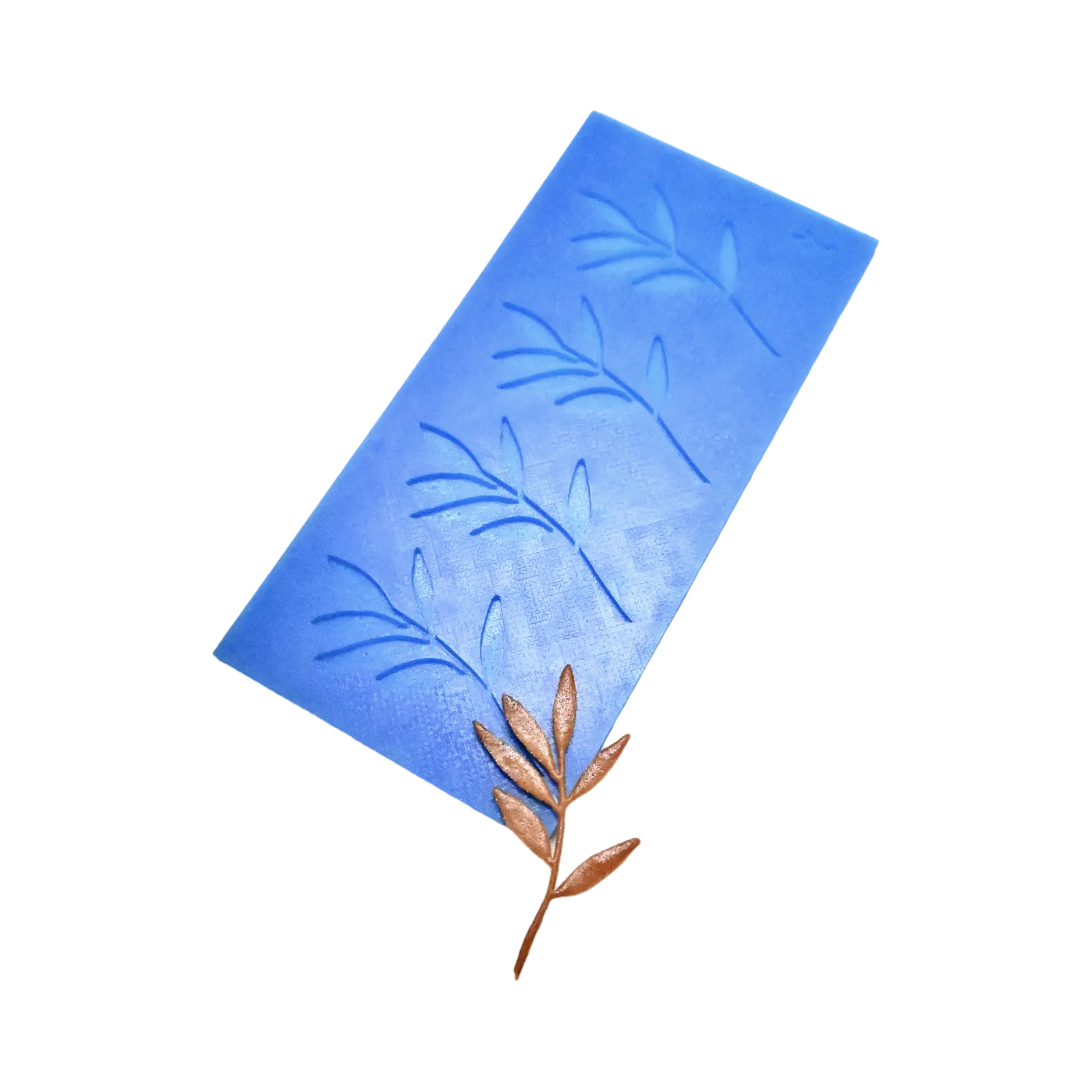 Blue silicone mat with olive branch shaped molds and a bronze tuile garnish.