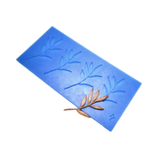 Blue silicone tuile mat with four olive branch shaped molds and a bronze garnish.