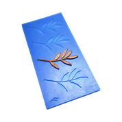Blue silicone olive leaf tuile mold with a bronze-colored edible branch garnish.