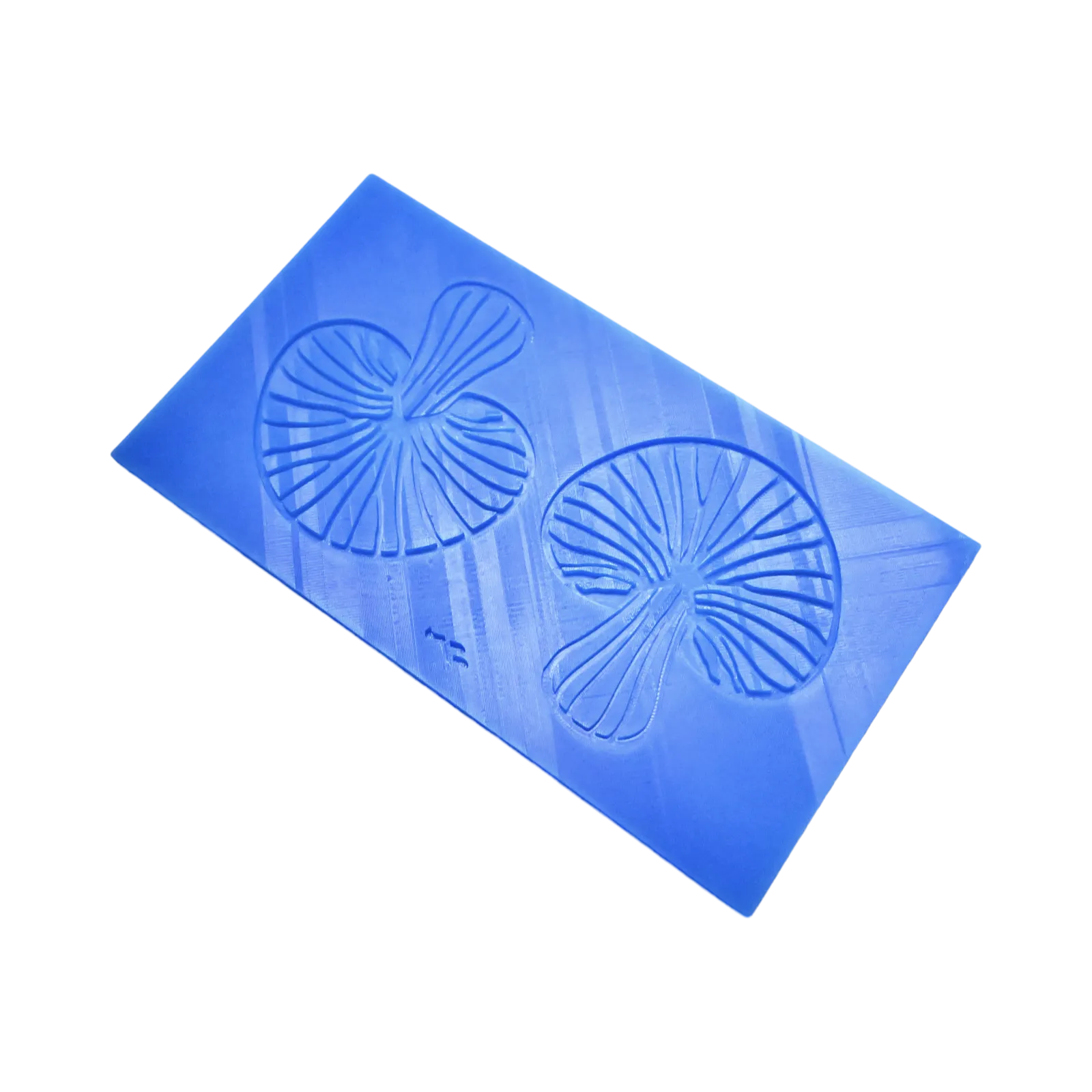 Blue silicone tuile mat featuring two detailed, fan-shaped mushroom molds.