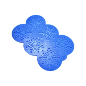 Blue silicone mat with six intricate snowflake-shaped tuile molds.