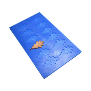 Blue silicone mat with detailed oak leaf shaped molds and a finished brown tuile leaf.