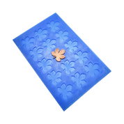 Blue silicone mat with horse chestnut leaf-shaped molds and a golden tuile garnish.