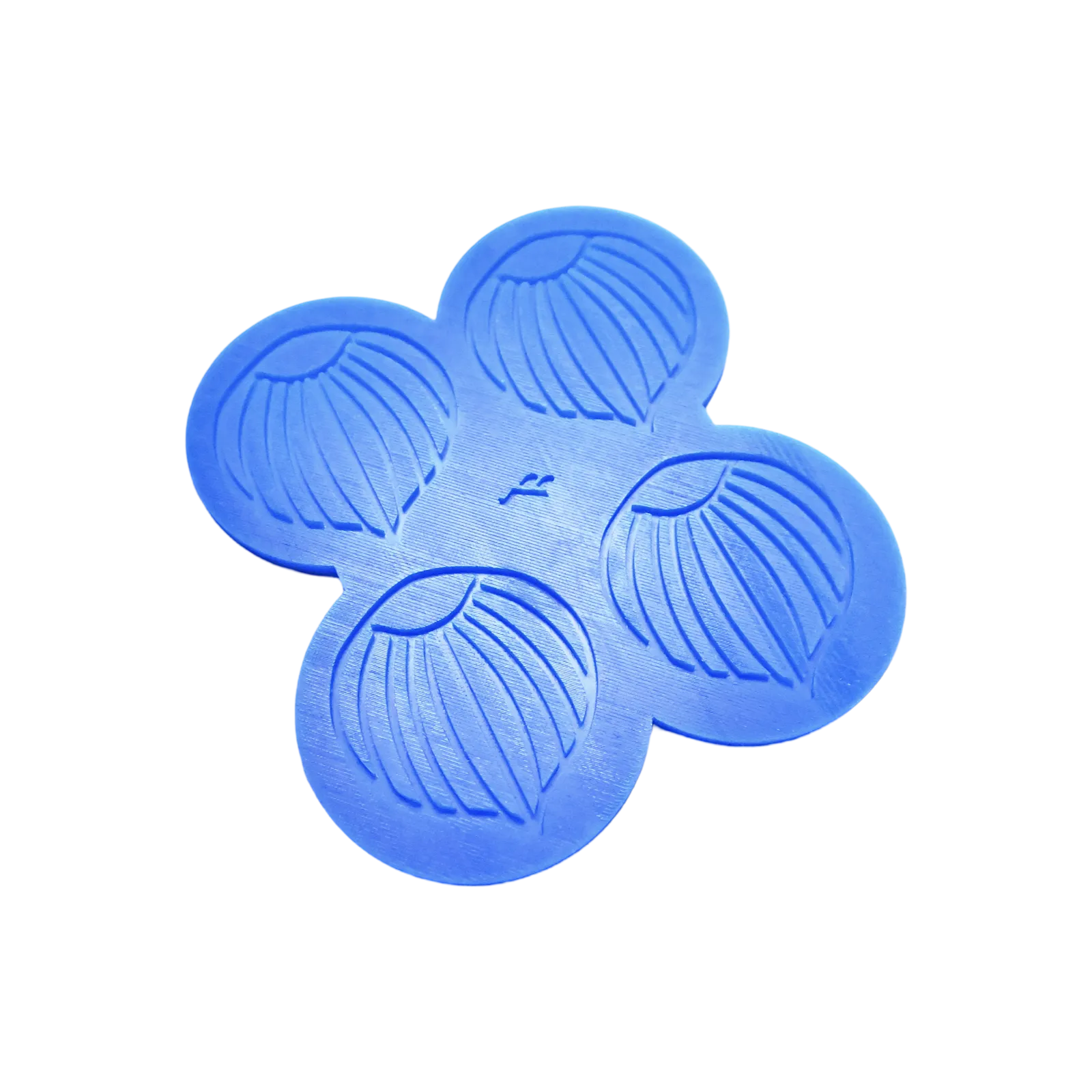 Blue silicone mat with four hazelnut-shaped tuile molds.