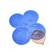 Blue silicone mat with four hazelnut-shaped tuile molds and a finished brown tuile.
