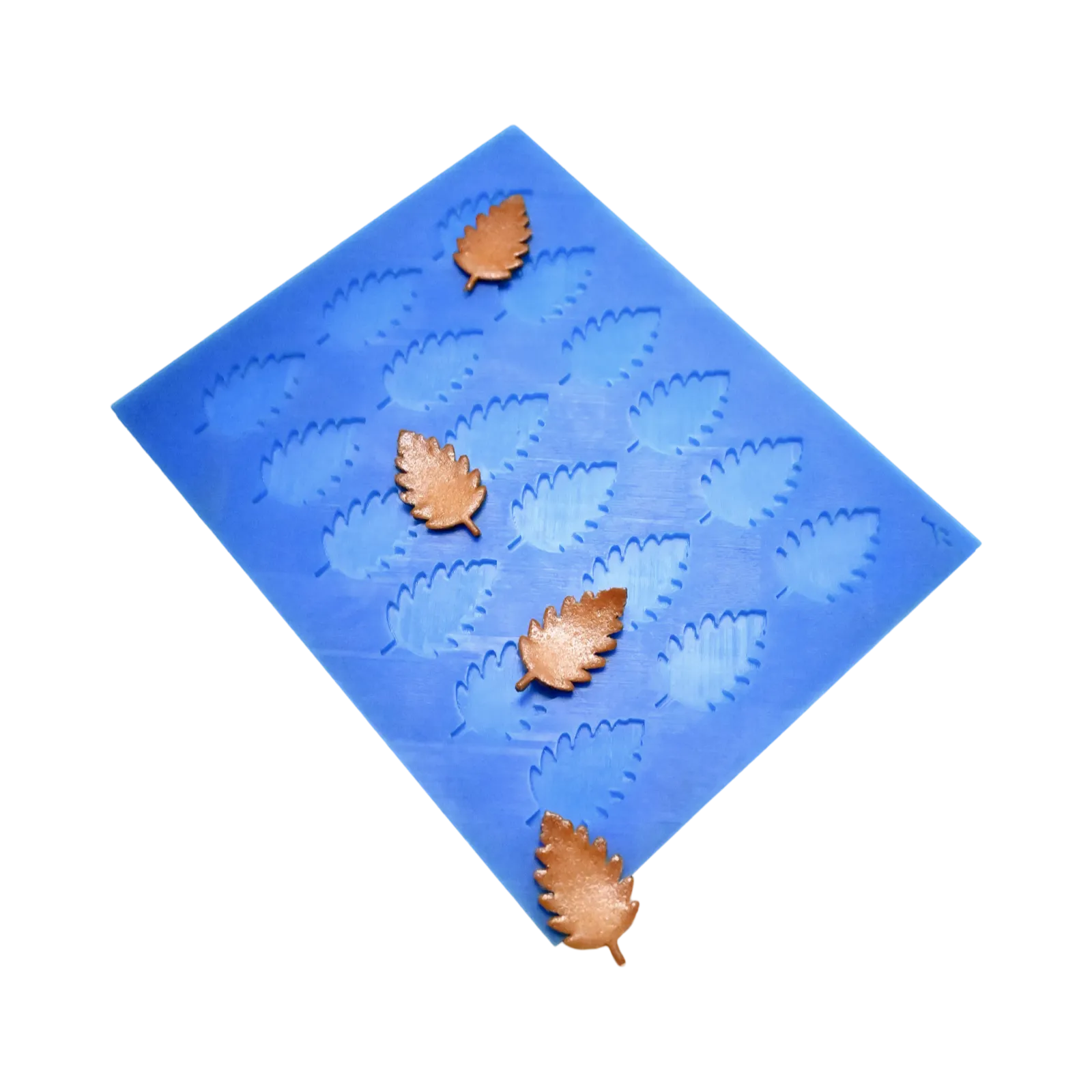 Blue silicone birch leaf tuile mold with brown leaf-shaped pastry decorations.